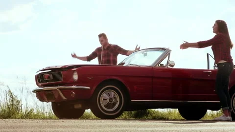 Couple have broken down with mechanical fault while driving a classic cherry red Видео 199632350