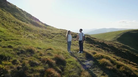Couple have fun and jumping on the mountain meadow Stock Footage 81279701