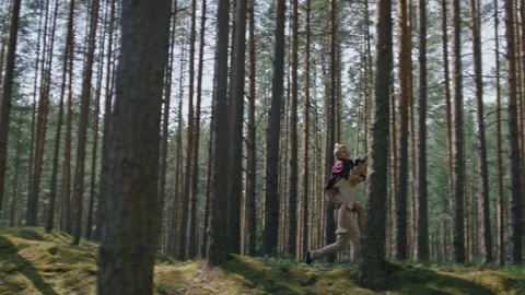 Couple have fun, run in forest on piggy back Stock Footage 162041514