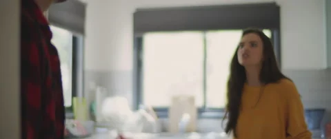 Couple having a big fight in the kitchen at home. Accusing of cheating Stock Footage 132365019