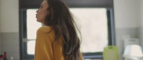 Couple having a big fight by the kitchen window. Accusing of cheating Stock Footage 132365031