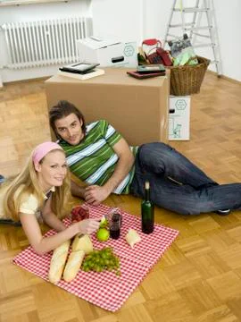 Couple having break in new flat Stock Photos