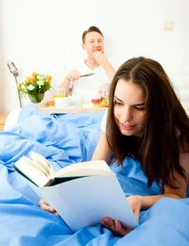 Couple Having Breakfast In Bed Photos