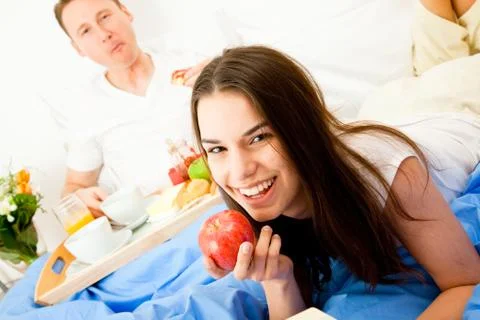 Couple Having Breakfast In Bed 写真素材