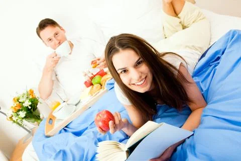 Couple Having Breakfast In Bed Stock Photos