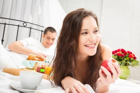 Couple Having Breakfast In Bed 스톡 사진