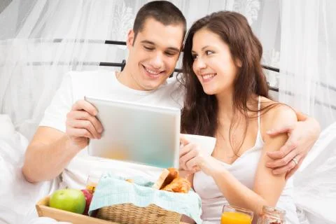 Couple Having Breakfast In Bed 写真素材