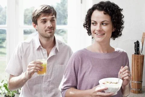 A couple having breakfast in the kitchen Stock Photos