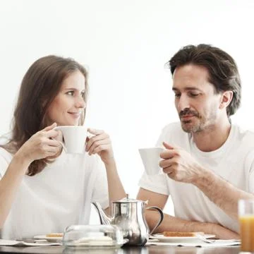 Couple having breakfast Stock Photos