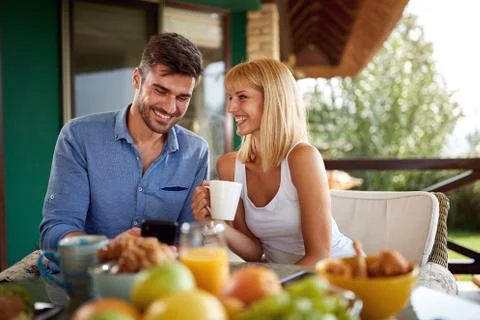 Couple having breakfast Stock Photos