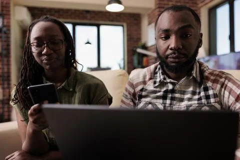 Couple having communication problems not talking to each other and using digital Stock Photos