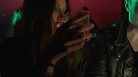 Couple having drinks at bar counter in night club Stock-Footage 50662258