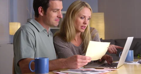 Couple having an easy time paying bills Stock-Footage 44480989