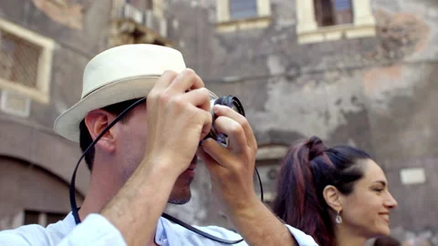 Couple having fun and taking pictures in catania Stock Footage 235383183
