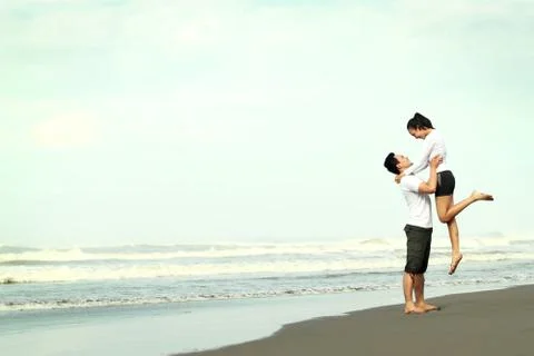 Couple having fun on the beach Stock Photos