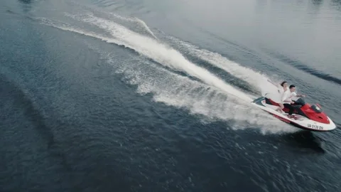Couple is having fun on a jet ski, view from drone Stock Footage 172311966