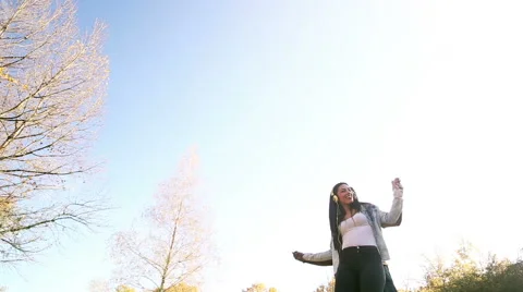 Couple having fun listening to music on headphones and dancing Stock Footage 59554868