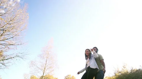 Couple having fun listening to music on headphones and dancing Stock Footage 59554897