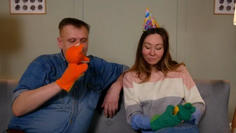 Couple having fun playing gloves dolls Video stock 126855464