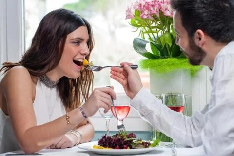 Couple having fun in restaurant. Stock Photos