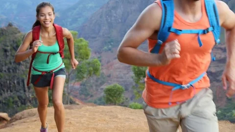 Couple having fun running playful laughing on hike Stock-Footage 73374755