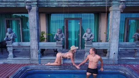 Couple having fun in the swimming pool Stock Footage 79497305
