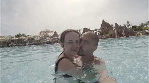 Couple having fun on the swimming pool Stock Footage 112130135