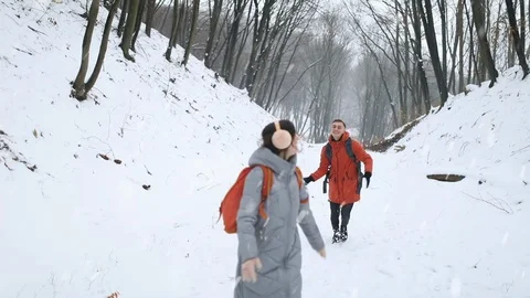 Couple Having Fun by throwing Snow Balls on Each other Stock Footage 103769381