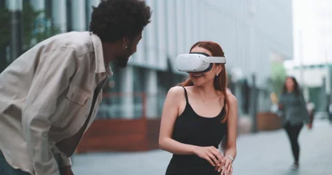 A couple having fun with virtual reality in the city Stock Footage 201686751
