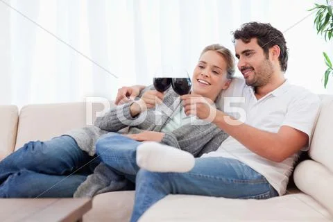 Couple having a glass of red wine Stock Photos