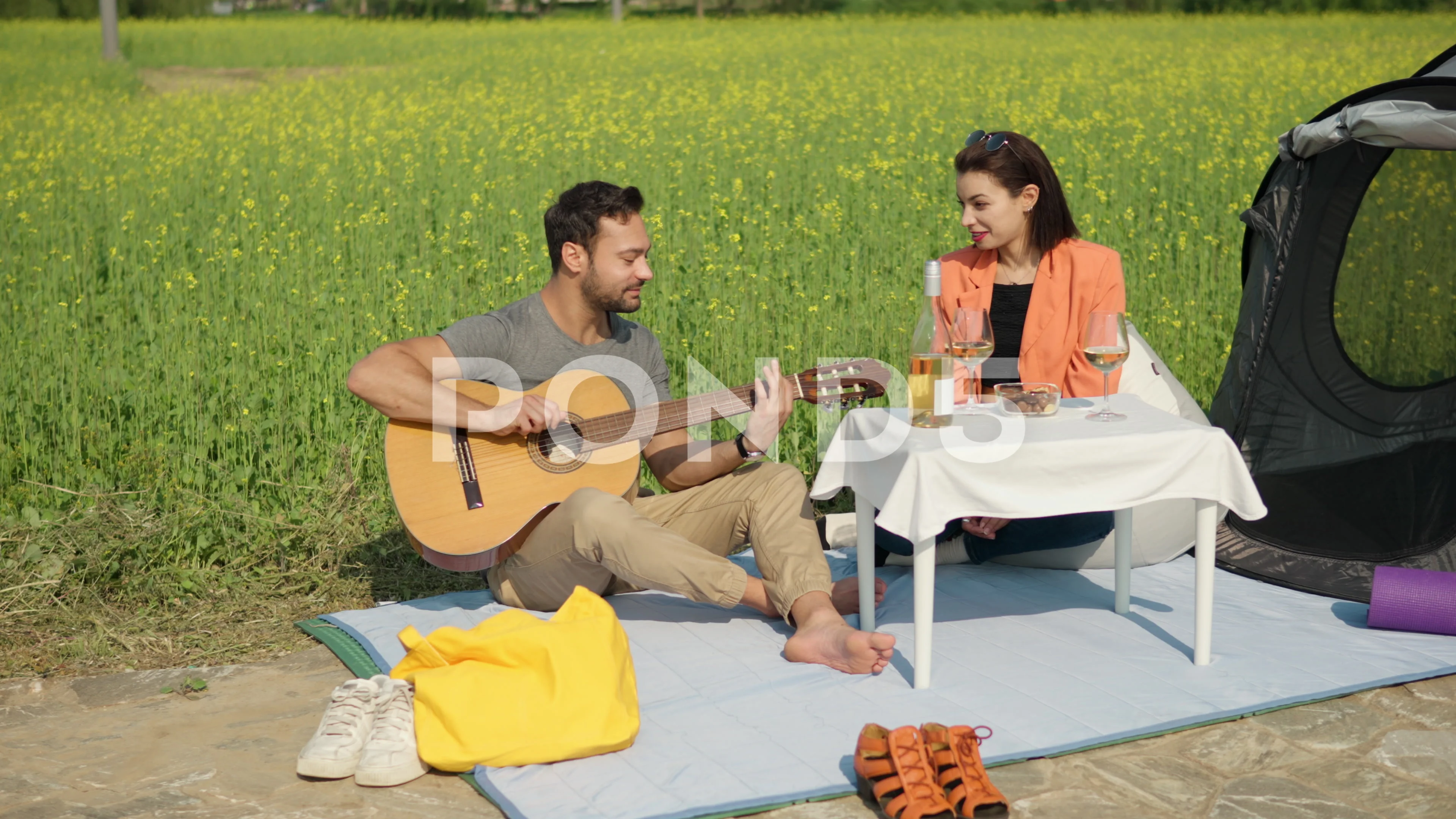 Couple Having Romantic Date Camping or Glamping in a Park by Yellow