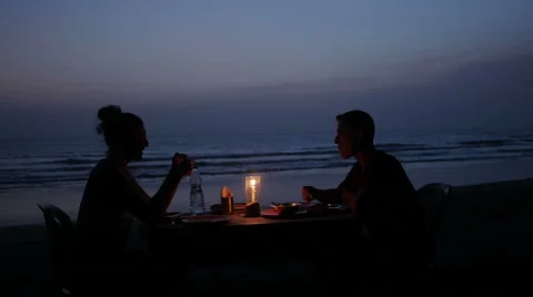 Couple having romantic dinner on beach Stock Footage 60939227