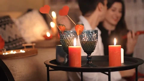 Couple having a romantic dinner decorated with candles at home. Valentine's day. Stock Footage 169048597