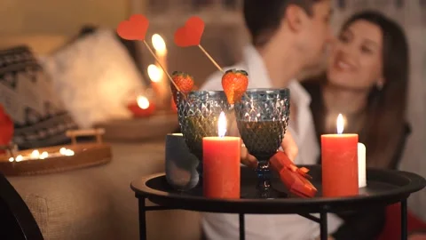 Couple having a romantic dinner decorated with candles at home. Valentine's day. Stock Footage 169048620