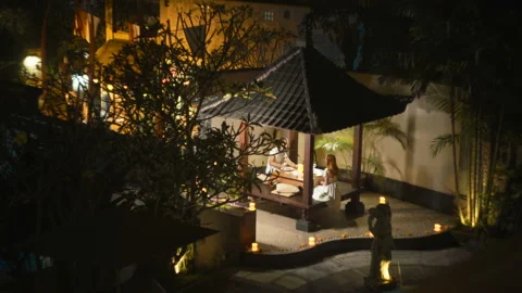 Couple having romantic dinner in gazebo Stock Footage 86561400