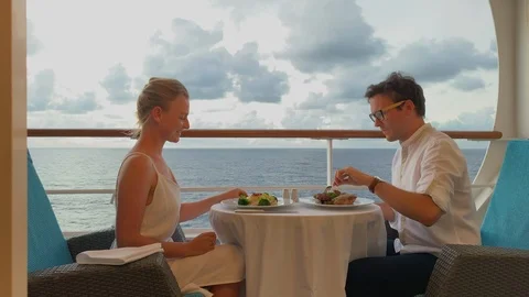 Couple having a romantic meal on a private balcony on luxury cruise Stock Footage