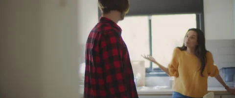 Couple having a serious conversation about their relationship in the kitchen Stock Footage 132365307
