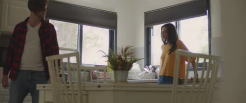 Couple having a serious conversation about their relationship in the kitchen Stock Footage 132365496