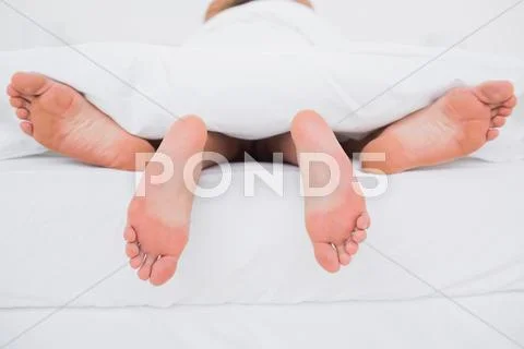 Couple having sex in bed Stock Photos