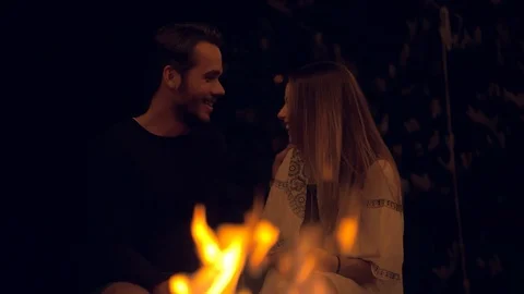 Couple having a talk at a fireplace Stock Footage 103152591