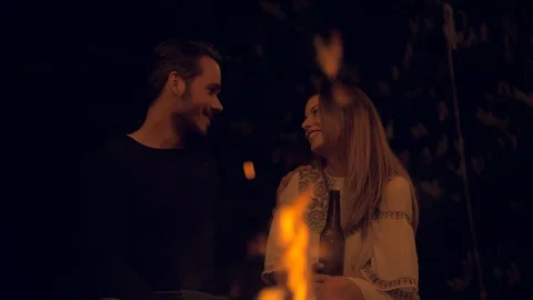Couple having a talk at a fireplace Stock Footage 103152644