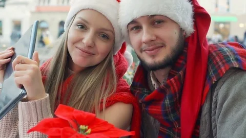 Couple having a videchat on tablet and smiling to the camera, steadycam shot 動画素材 71581288