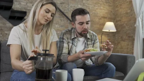 Couple having video call during their lunch break on laptop Stock Footage 233436333
