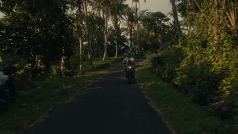 A Couple with helmets exploring a jungle in Bali Stock Footage 269205775