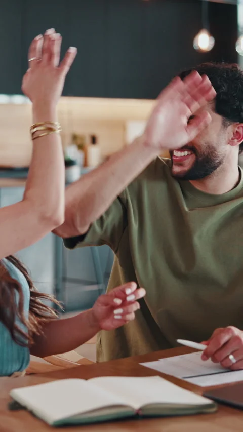Couple, high five and tech for home finances of people with savings, loan Stock Footage 346940025
