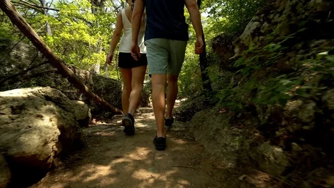 Couple Hikes Rock Path in Forest Vidéo 97126602