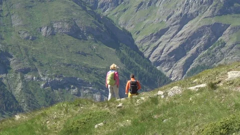 Couple Hiking Down Mountain On Steep Dangerous Track Stock Footage 93344537