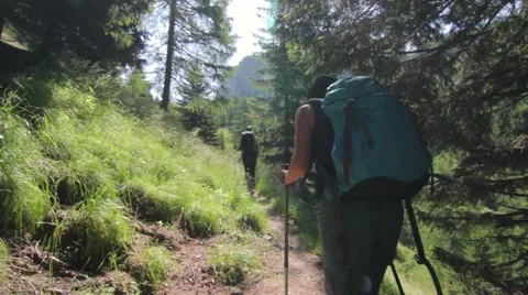 Couple hiking on a mountain path Видео 52512053