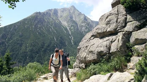 Couple hiking in the mountains Stock Footage 7902116