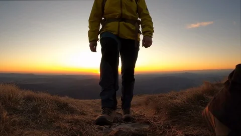 Couple hiking at sunset Stock Footage 129439253